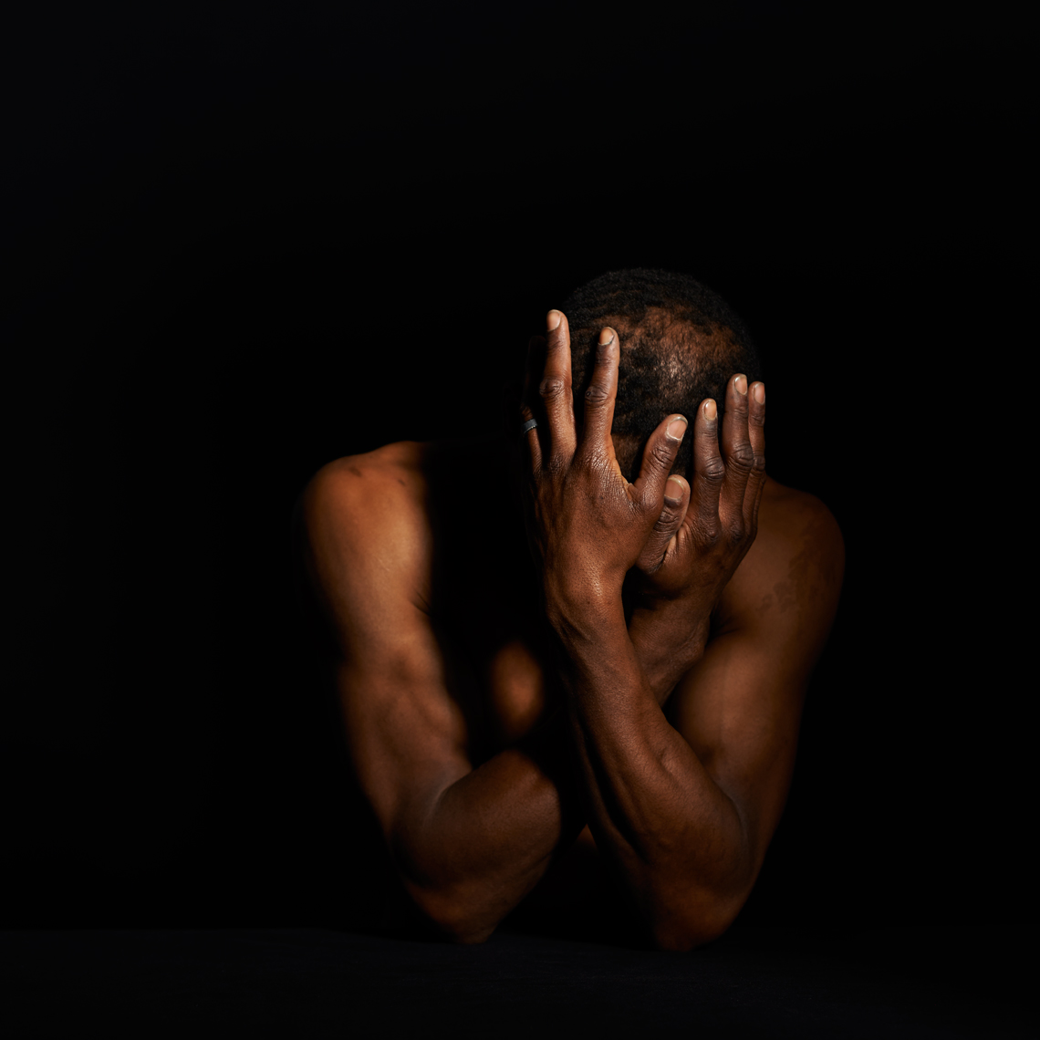 Jendayi portrait African American man head in hands