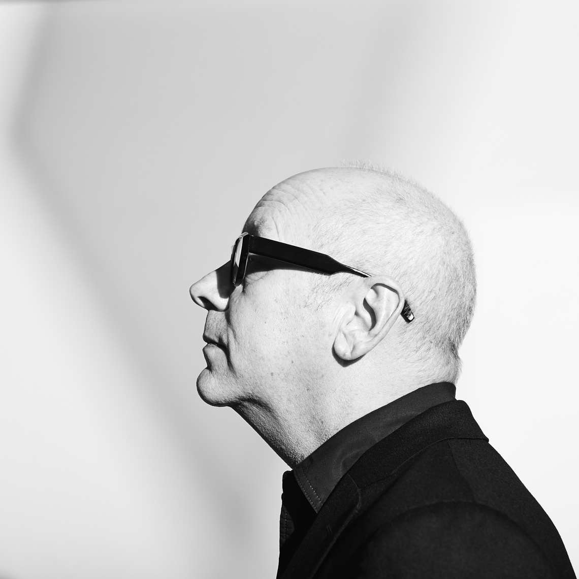 Unique profile portrait of bald man with glasses_black and white