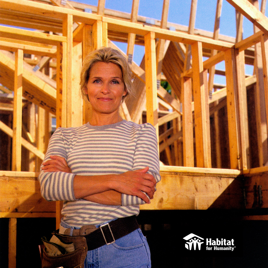 Habitat for Humanity Woman striped shirt arms crossed