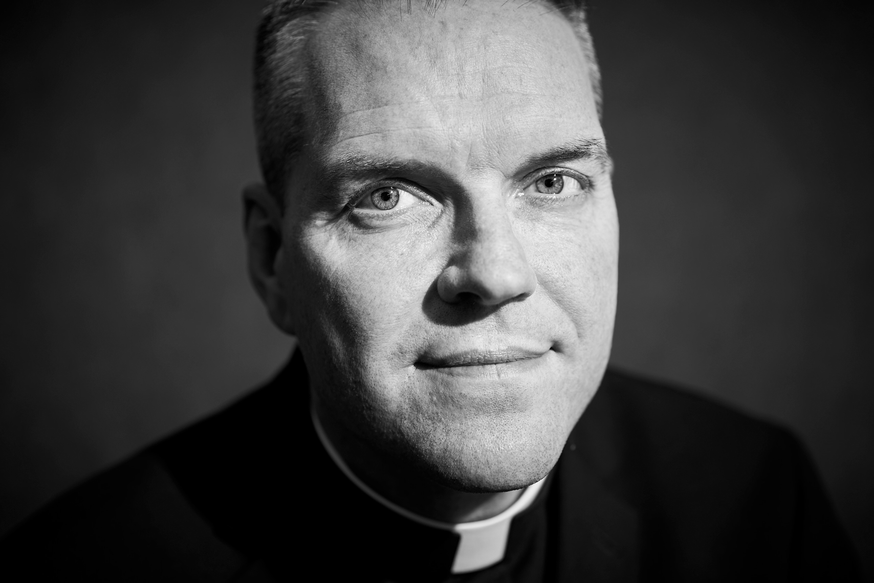 Black and White portrait of a priest Father Burns
